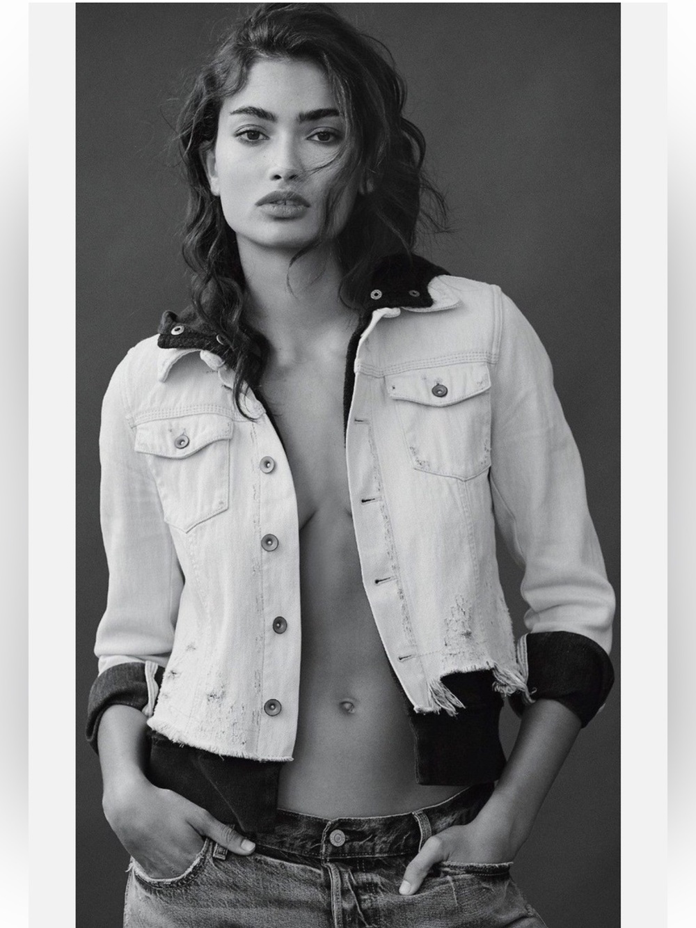 Womenβs Distressed Denim Jacket in Light Wash